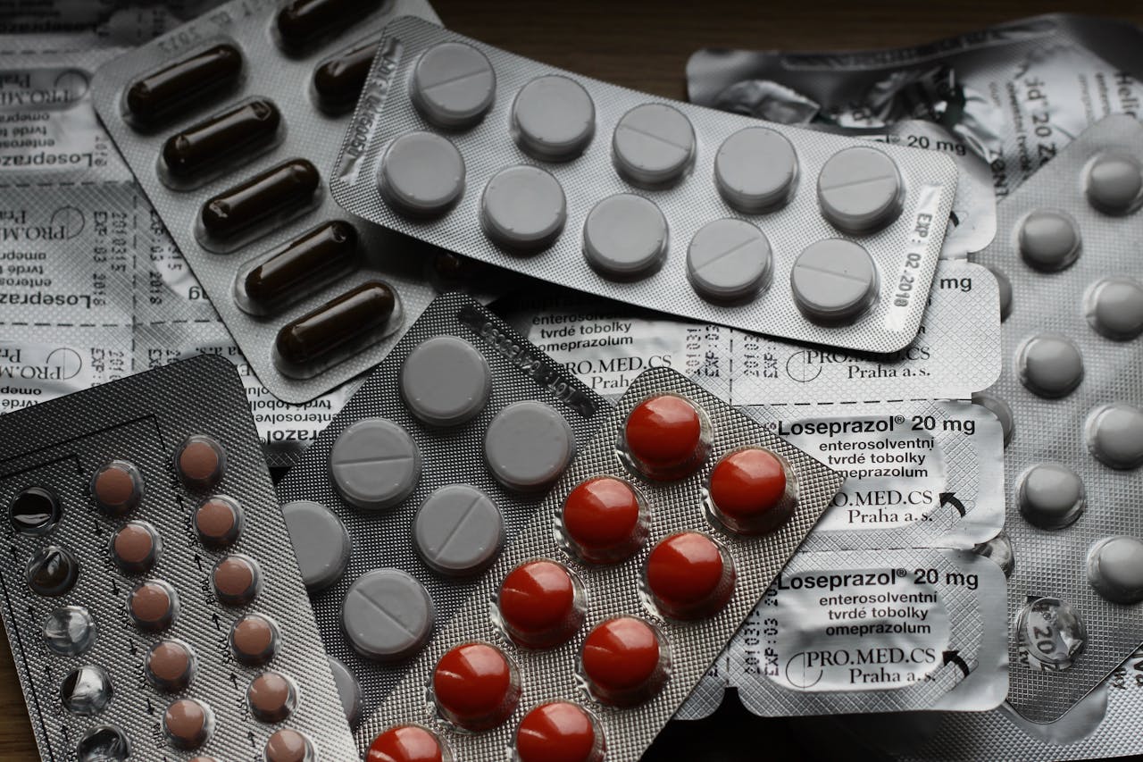 hero-img-02 Close-up of various pills in blister packs showcasing medical and healthcare themes.